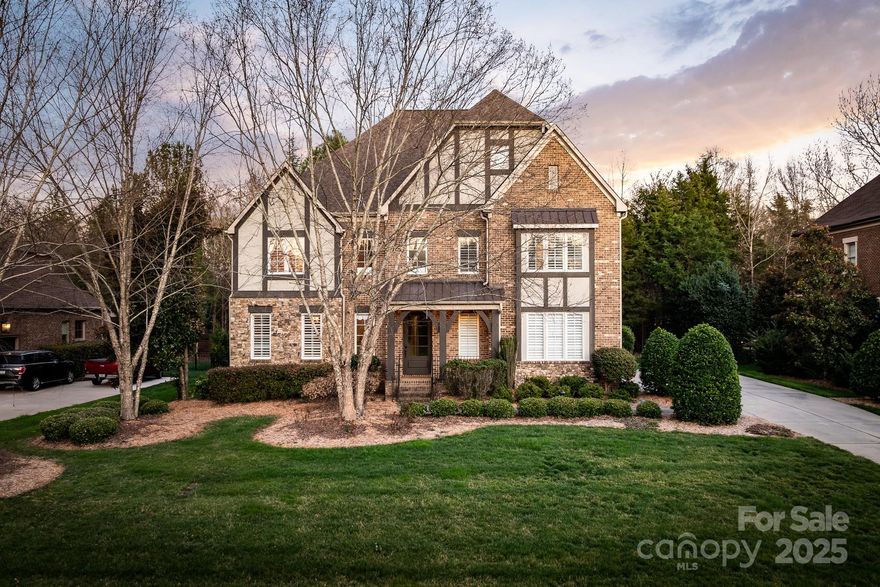 Luxury Meets Location in Longview. Exquisite English Tudor offers luxury & convenience. Grand 2-story foyer welcomes you w/dramatic curved staircase. Gorgeous tray ceiling highlights formal dining room. Gourmet kitchen w/ss sub zero fridge,Kitchenaid range,wall oven & wine fridge.  Screened porch & stone patio w/fire pit. Living room w/stacked stone fireplace. Main level guest suite. Upper level luxurious primary bedroom w/sitting area, & exquisite primary bath featuring dual private bath areas with separate entries, vanities & closets. The study/library w/cherry bookcases offers abundant natural light. Third floor is large bonus room w/a wet bar & full bath. Ideally located, top-rated Marvin Ridge schools and minutes from  and Ballantyne. Golf & Social memberships available including, golf practice facilities, fitness center, tennis courts, swimming pools, youth lodge, dining areas, and meeting rooms at The Club at Longview, as well as Club-sponsored golf, social events & activities