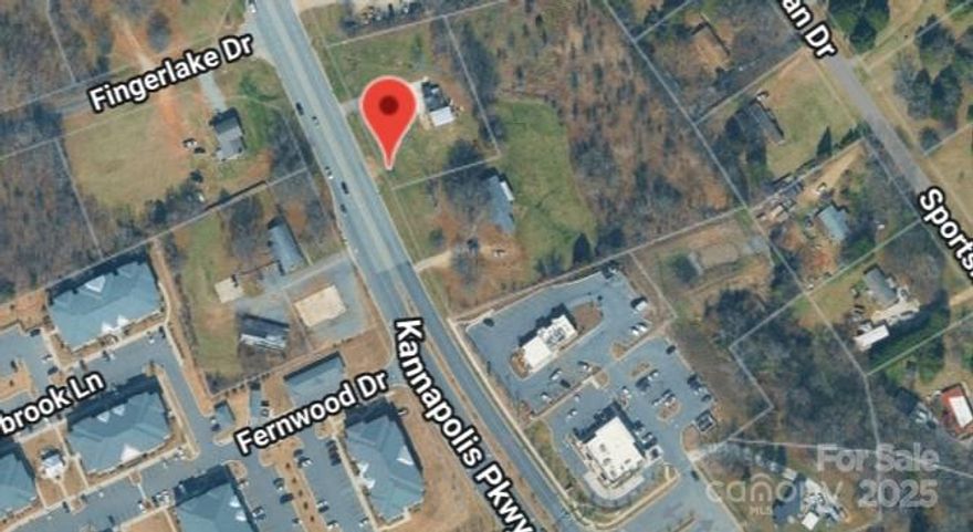 NEW LOWER PRICE!! This highly prized location with a traffic count of 38 thousand cars per day per NCDOT is a great buy! You owe it to yourself to check it out. Located across the street from the Afton Ridge Shopping Center. This property is being sold for the land, the buildings have no value.