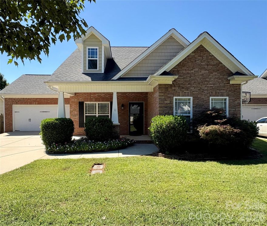 Convenient to Charlotte, Concord or Monroe but country living at its finest! Tucked away on one of Locust's most peaceful, tree-lined streets, this one-of-a-kind gem offers more than just a place for your family to live...it is a classic Carolina lifestyle! Church Street has a welcoming Hallmark movie feel to it. As you step up to the covered front porch encased with custom detail, a feeling of relaxation is immediate. Plenty of room for rocking chairs! There is a calm of country charm fused with modern comforts. Fireplace in great room is visible from the front door,
split bedroom plan offers primary ensuite privacy. New paint and carpet, spacious kitchen with eat-in bar, granite counter tops, custom cabinets, and many other amenities that make this kitchen a chef's dream! Private ensuite lovely views of backyard. Large vanity, sep shower and tub, walk in closet, and more. Covered porch in back, enclosed, fenced back yard is ready for your pets! Nice two car garage. Character throughout! Doll house!