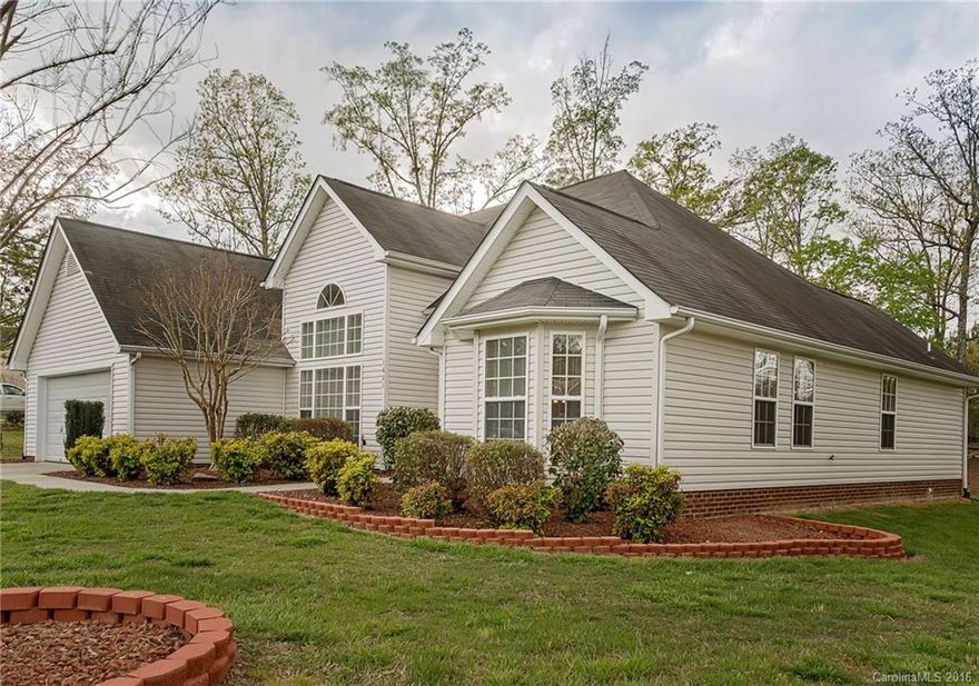 This dream home is definitely move-in ready and convenient to Charlotte, Concord, and Albemarle.  The current owners have updated the kitchen with granite counters, new cabinets, and stainless steel appliances. Bathrooms also feature granite counters and tile floors. There is a 20x20 separate storage/workshop building with concrete floors and electrical service for all your storage and projects. Home Warranty of America Diamond Level offered by Seller