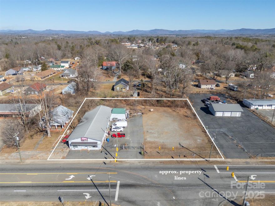 Prime commercial opportunity in the heart of Spindale! This versatile property offers endless possibilities, could have multiple businesses operating under one roof, or a complete redevelopment project. Currently being used as an auto repair shop. The property is fenced with a gate and separate entrance for the building. 3 Bays for a workshop, 2 seperate offices, 2 restrooms, and a few storage rooms. Positioned across from the Thermal Belt Rail Trail and conveniently located on Hwy 74 Bus and intersection of Oakland Rd.  Alternatively, this could be the ideal location for a strip mall catering to the needs of Spindale’s growing community. High visibility and a strategic location make this a rare find for entrepreneurs and developers alike!