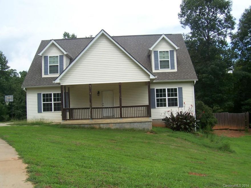 Rocking Chair Front Porch On Secluded Lot. Large Family Room w/Hard Wood Floors.  Dining Room. Kitchen with Stainless Steel Appliances, Island Work Station &  Breakfast Area. Master On The Main w/ Master Bath w/Garden Tub, Dual Sinks & Separate Shower.  Upstairs Two Bedrooms w/ Bath. Also 2 large unfinished rooms for expansion possibilities Large Wooden Deck Overlooking Wooded & Flat Backyard. Owner Will Consider Lease/Purchase.