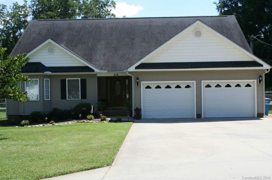 Tons of custom work throughout this beautiful ranch. Custom cabinets in the kitchen,laundry rm & bathrms. Custom molding,recessed lighting,ceiling fans & hardwood floors throughout. Gorgeous stone fire place w/ stunning log mantle in the great rm w/ catherdral ceilings. Custom built in entertainment center. French doors lead out to large fenced back yard. Tons of storage- closets, lofts in garage & built in shelves. Garage has its own HVAC & pre wired for cable. Cost effective Hybrid heat system