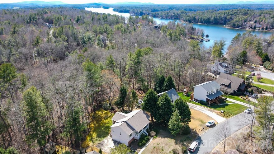 Dreaming of living at the lake?,  come see this 3BR, 3Bath ranch home w/vaulted ceilings, main floor owners bedroom, split bedroom layout, gas log fireplace plus you will love having morning coffee on the screened in porch listening to nature. Home also has partially finished basement w/large family room great for entertaining and full bath plus oversized 2 car garage. Plus dont forget your boat or jetski as home includes your own boat slip to enjoy all that LAKE JAMES has to offer.