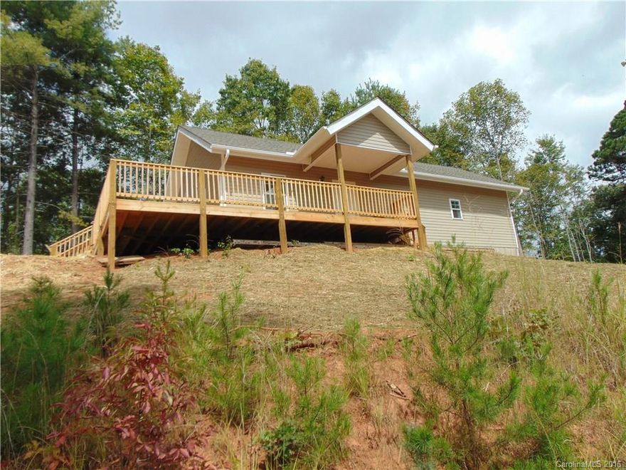 Brand New Energy Efficient Home Convenient to Mars Hill, Marshall and Weaverville. Spacious kitchen with granite counters, upgraded cabinets and stainless appliances. Great open floor plan with vaulted ceilings, ceiling fans and track lighting. Enjoy the amazing views from the large wraparound deck. Constructed with 5.5 inch thick structurally insulated panels and low impact helical pile foundation. This home has just been completed and is move in ready.