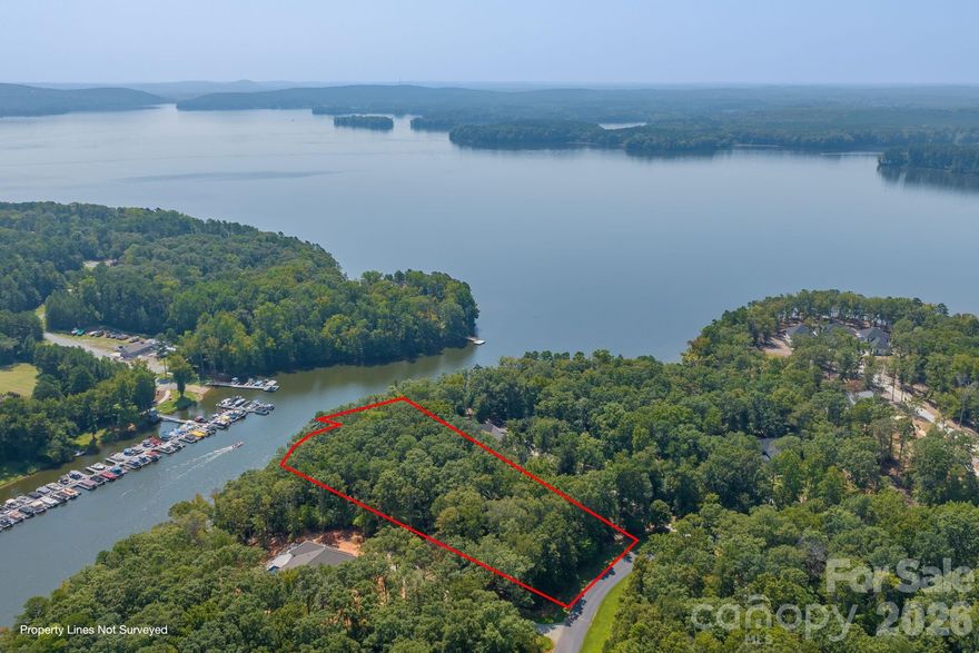 Excellent opportunity to build your dream home on this waterfront lot on High Rock Lake in the prestigious Yachtsman's Point Community. Boasting over 225 ft of lake frontage, this 1.59 acre wooded lot is a perfect blank canvas for the home of your dreams & a clean slate for the builder of your choice. Offering deep water access for boating enthusiasts & the ability to build your own private pier. Enjoy sunset views, marina views & waterfront nature views year round. High Rock is a gem for nature lovers & outdoor enthusiasts; whether you're looking to fish, swim, kayak, water ski or birdwatch, this is a perfect spot! Share the waterfront lifestyle within Yachtsman's Point & take advantage of the amenities offered; heated outdoor pool, tennis & pickle-ball courts, gazebo; walking and biking trails; boat storage, water access & private boat ramp at SkipJack Harbor & Marina. Close to I-85 and only an hour from Charlotte.