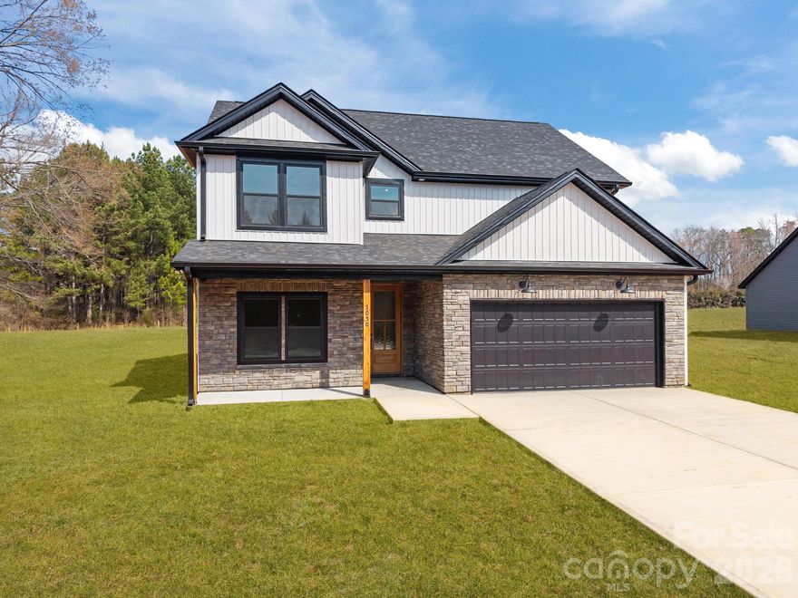 Beautiful new construction farmhouse on .487 AC just outside city limits! Open floor plan w/ 9 ft ceilings, LVP flooring, office/flex room, and stunning great room w/ shiplap accent wall. Kitchen w/ granite, tile backsplash, island & pantry. Spacious primary suite w/ WIC & ensuite. 2-car garage, main level laundry & drop zone. Well & septic—NO city taxes!