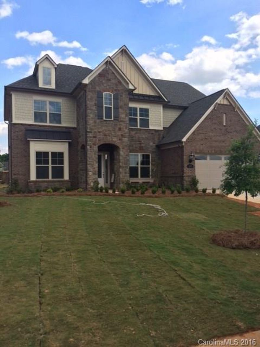 Beautiful 3-story brick and stone home in intimate community approx. 2.5 miles from Ballantyne in Indian Land.  First floor includes guest suite with full bath.  Stunning kitchen has top grade cabinets with dovetail construction, soft close doors & drawers, pullout shelves.  All stainless appliances.  Durable laminate hardwood throughout first floor.  Third floor features 600 sq. ft. bonus w/ powder room and storage areas.  Community convenient to Ballantyne with low Lancaster County taxes.