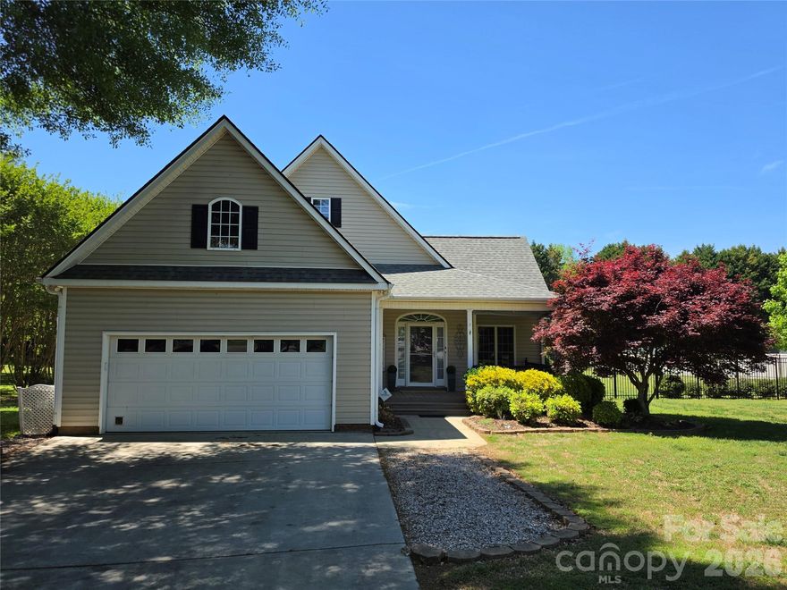 Welcome to this beautiful home in The Hylands, where peaceful living meets thoughtful design on a beautiful acre homesite in York, South Carolina.

From the moment you arrive, you will appreciate the privacy, mature trees, and natural setting that make this property feel like your own retreat. The inviting front porch welcomes you inside to a warm and open great room with natural light, and an easy flow into the formal dining area with vaulted ceiling, making it ideal for both everyday living and hosting gatherings.

The kitchen offers granite countertops, generous cabinet space, and ample prep areas for cooking and entertaining. The main level primary suite is filled with natural light and even offers direct outdoor access for quiet mornings with coffee. The private ensuite features a dual sink vanity, soaking tub, and tiled shower for a relaxing end to the day.

Upstairs, you will find a spacious bonus room that can easily serve as a fourth bedroom, media room, or home office. In addition, there is a versatile flex space that allows you to customize the home to fit your needs, whether that is a playroom, hobby room, or secondary office.

Storage is one of the standout features of this home. There is an impressive amount of attic storage space, providing room for seasonal items, decorations, and long term storage without sacrificing living areas. The two car garage also includes a dedicated storage closet space.

Step outside and you will truly see what makes this property special. The greenhouse is a beautiful addition, with established plantings that return seasonally and create stunning blooms year after year. The surrounding trees creating a peaceful and charming outdoor environment, you can enjoy bird watching right from your own yard. The backyard has been designed for enjoyment, complete with a fire pit area for all the gatherings.

Whether you are enjoying coffee on the porch, tending to the greenhouse, hosting dinner in the dining room, or relaxing by the fire pit, this home offers the kind of lifestyle that feels intentional and serene.

If you have been searching for a home with character, space, storage, and a truly special outdoor setting, 310 Little Daisy Lane is ready to welcome you home.