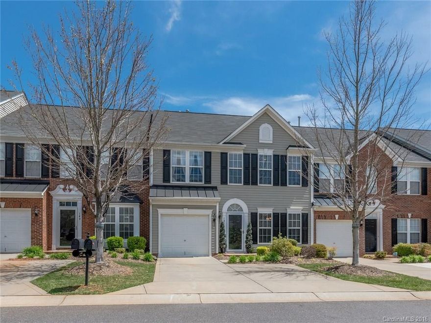 Wow! Stunning Townhome with Upgrades throughout! Granite counters and tiled backsplash in Kitchen with gas stove and double pantry. Formal dining & eat-in breakfast area. Hardwoods throughout first floor including Sunroom. Gas fireplace & transom windows letting in tons of natural light! Double crown molding. Upgraded lighting & fans. Tray ceiling in Master. Master Bath with separate tub & shower, & two separate walk-in closets. Neighborhood Pool. Fort Mill schools. Close to CLT and I-77!