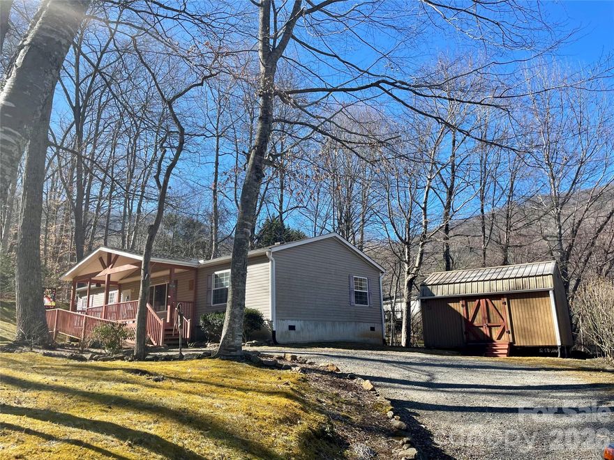 Major price improvement! Priced below 2024 appraisal. Don't miss out on this almost completely furnished move-in ready home in a desirable neighborhood!The home has 3 separate bedrooms but is on a 2 bedroom septic system. Sellers have lovingly cared for this very well-maintained home with a split bedroom plan that sits on a nearly 3/4 acre lot with a bold creek running the back length of the property.  Relax on the covered front porch with a good book and enjoy the cool shade that the mature deciduous trees provide in the warmer months, gorgeous fall foliage in the autumn, and the mountain views in the winter. The practically new partially covered back deck that overlooks the creek is great for grilling out and entertaining.  Wired tied down storage shed is perfect for a workshop or craft room. Conveniently located less than 2 miles from Russ Avenue. Easy access with paved roads all the way to the gravel driveway. Features include: New roof (January 2025) with 30-year warranty, BathFitter showers with lifetime warranty, new stove and washing machine 2025, new back deck installed by Lowe's 2022, HVAC replaced in 2018, serviced yearly, new blower motor on compressor replaced 2025, water filtration system, water heater in 2021. Sellers will provide documentation on maintenance, repairs, and warranties as well as their inspection performed when they bought it. Schedule your showing today-sellers are motivated.