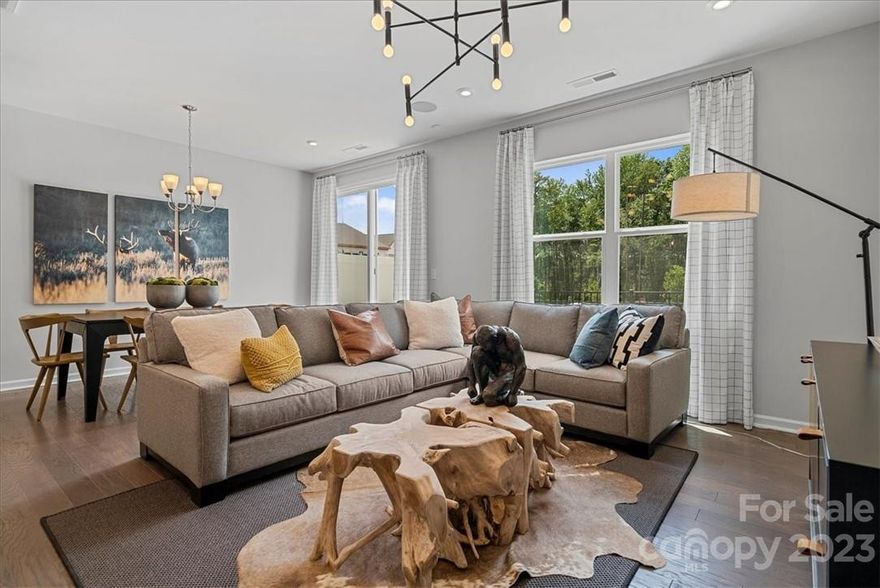 Incredible Model Home for Sale with the Serene II Design Package, an Upgraded Kitchen w/ 30" Electric Range, 6' Sliding Glass Door in Dining Room Connecting to an Extended 10' x 10' Patio, Pet Area Under Staircase, Oak Box Staircase, Brick Wallpaper Accent Wall in Foyer, Upgraded Primary Shower w/ Tile Walls, Shiplap Accent Wall in Primary Suite, and Upgraded Secondary Bathroom w/ Tub Surround at a Competitive Price. Appliances (Refrigerator, Washer, and Dryer), are included with purchase.

The kitchen presents a high-end 30" electric cooktop, elevated stainless steel appliances, stone gray cabinets, crisp white backsplash tile, all tied together by the stunning Marengo quartz countertops. The dining room has a 6' sliding glass door connecting you to the 10' x 10 extended patio. Upstairs, there are two bedrooms, including the primary suite, featuring an upgraded tile shower with a seat. Across from the primary suite is the upstairs laundry room and a secondary full bed and bath.