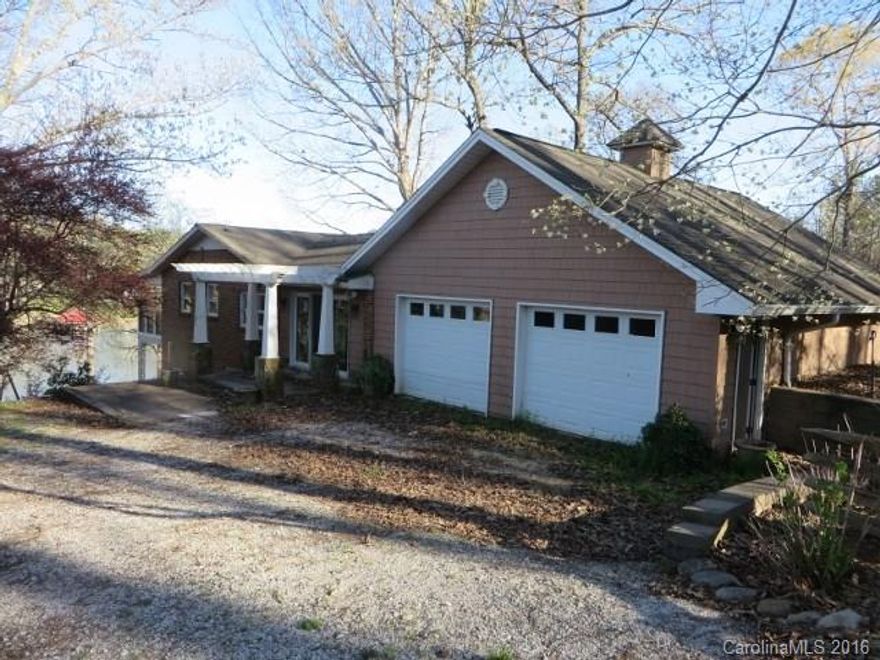 Waterfront Home with some updates in Kitchen, Family Room and Garage in 2002. Ranch/Basement, Separate Living Quarter, Two Gas Fireplaces, Nice Sun Porch with Windows for Entertaining and Great Views of Lake Norman, Granite Countertops, Hardwood Floors on Main Level, Ceramic Tile Floors on Lower Level.  2 car garage, large lake side patio and dock with boat slip.  Must See This Unbelievable Waterfront Home at such and affordable price!