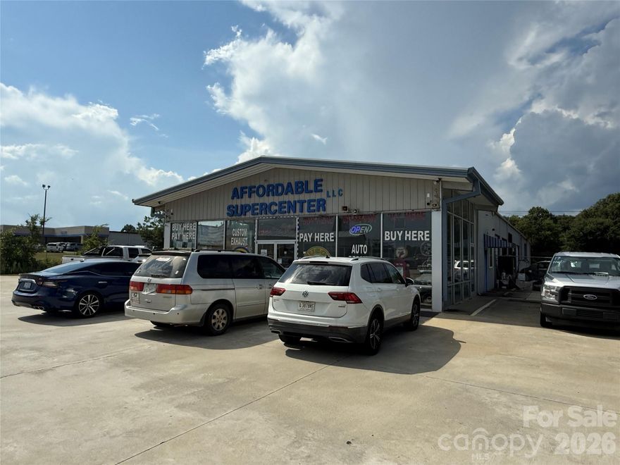Rare opportunity to acquire a 7-acre, income-producing automotive property in a prime retail corridor directly across from Walmart and Lowe’s. This offering includes a fully operational auto dealership and auto repair facility, along with equipment, vehicles, tow trucks, and existing business inventory, allowing a buyer to step into an established operation or reposition the site for future growth.
