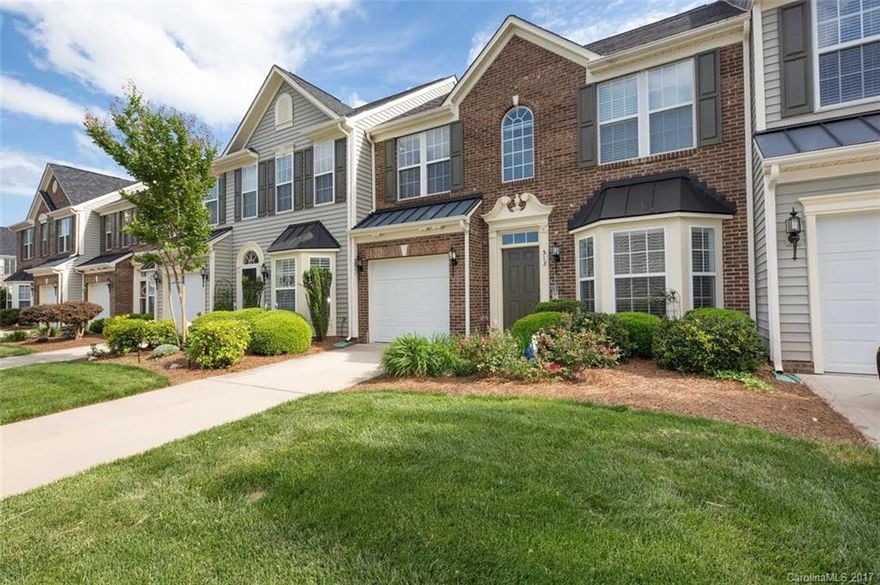 Enjoy the solace of lake living in this community with this beautiful 2 story townhome which is only minutes from dining, shopping, and so much more. It has beautiful hardwood floors on main and carpet in the bedrooms. Spacious master bedroom on the main has trey ceilings, while master bath has double sinks, a separate shower, and a garden tub. This beauty has a loft that overlooks the great room, which has gas fire logs. Enjoy a relaxing day by the community pool.