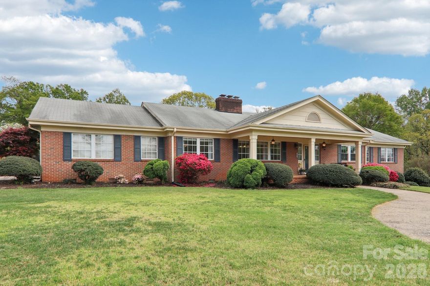 Welcome to this spacious and beautifully updated brick home in the heart of Spindale! Offering 4 bedrooms, 2.5 baths, and an abundance of living space, this property combines classic charm with modern upgrades—perfect for comfortable everyday living and entertaining.

Situated on a generous 0.51-acre lot, this home features both a 2-car garage and an additional 2-car carport, providing ample parking and storage. Inside, you’ll find large, inviting rooms throughout, including a bright Living Room with a cozy fireplace and a warm, welcoming Family Room with gas logs—ideal for gathering with family and friends.

The kitchen has been thoughtfully updated within the past two years with 42-inch soft-close cabinetry, stunning granite countertops, and a full suite of stainless steel appliances, including a stove, dishwasher, microwave, and refrigerator. Adjacent to the kitchen, the Family Room and Sunroom create a seamless, open living space with easy access to the backyard oasis.

Step outside to enjoy your private in-ground swimming pool—perfect for summer relaxation and entertaining. The unfinished walk-out basement offers endless potential for additional living space, a workshop, or storage.

Additional recent updates include new windows in the kitchen, primary bedroom, primary bath, and two additional bedrooms, along with a new vanity in the primary bathroom.

Located within walking distance to Spindale’s vibrant Main Street district and just minutes from the popular Thermal Belt Rail Trail, this home offers both convenience and lifestyle.

Don’t miss this opportunity to own a move-in-ready home with space, updates, and an unbeatable location!