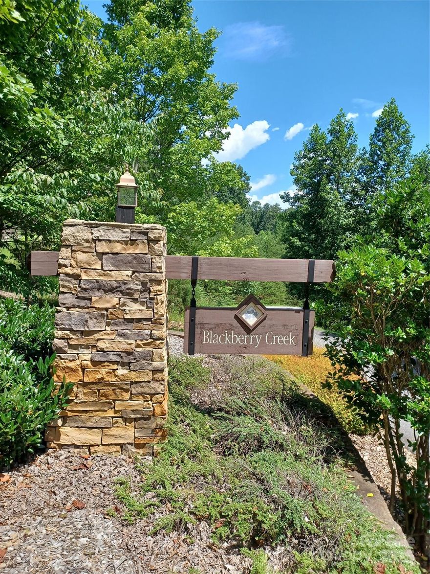 Here is your chance to build your mountain dream home in a rural gated community. Blackberry Creek subdivision is located in the beautiful mountains of McDowell County close to the I-40 corridor and nearby Lake James State Park.  This wooded lot sits on a privately maintained paved road with a gradual slope down to a creek running through the rear of the property. This is the perfect setting to build a beautiful log home. HOA CCR's give permission for Blue Ridge Log Homes is an approved builder and has model homes that can be toured in person or on-line.