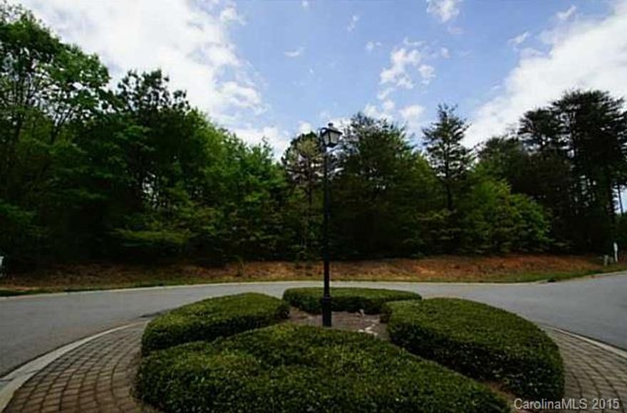 Most convenient location in The Point! Gorgeous 1.28 acre private, cul-de-sac lot. Wooded and mostly level with renewed 4 Bedroom septic permit ready to build your dream home. Bring your builder (with approval) and build now or in the future. Easy walk to boat slip at end of street (included). Short bike ride to club and all the amenities The Point offers as lot is conveniently located on same side of Brawley School Rd as the club. Come Enjoy Lake living at it's finest!