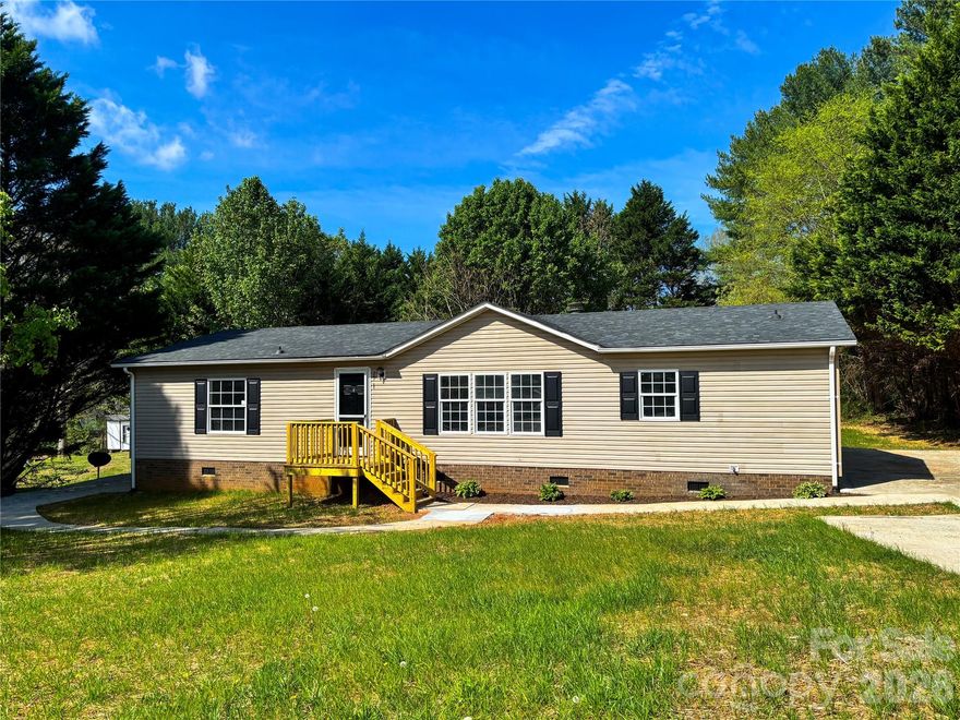 BEST OFFER DEADLINE: Friday, April 10 at noon. Newly renovated three bedroom home offers brand new HVAC, new roof, all new vinyl plank flooring, stone countertops, all new neutral paint, renovated bathrooms with new vanities, new lighting, and more! The open floor plan features lots of natural light with stuccoed walls and wood burning fireplace, arched doorways, a charming kitchen with lots of cabinet space, and new double doors exiting to the rear deck. The split bedroom layout offers a private primary suite with large walk-in closet and full bath with new updates. The secondary bedrooms both have walk-in closets and share access to the hallway bathroom. 0.42 Acre level lot with double concrete driveways and brand new decks. New roof in 2025, new HVAC in 2026.