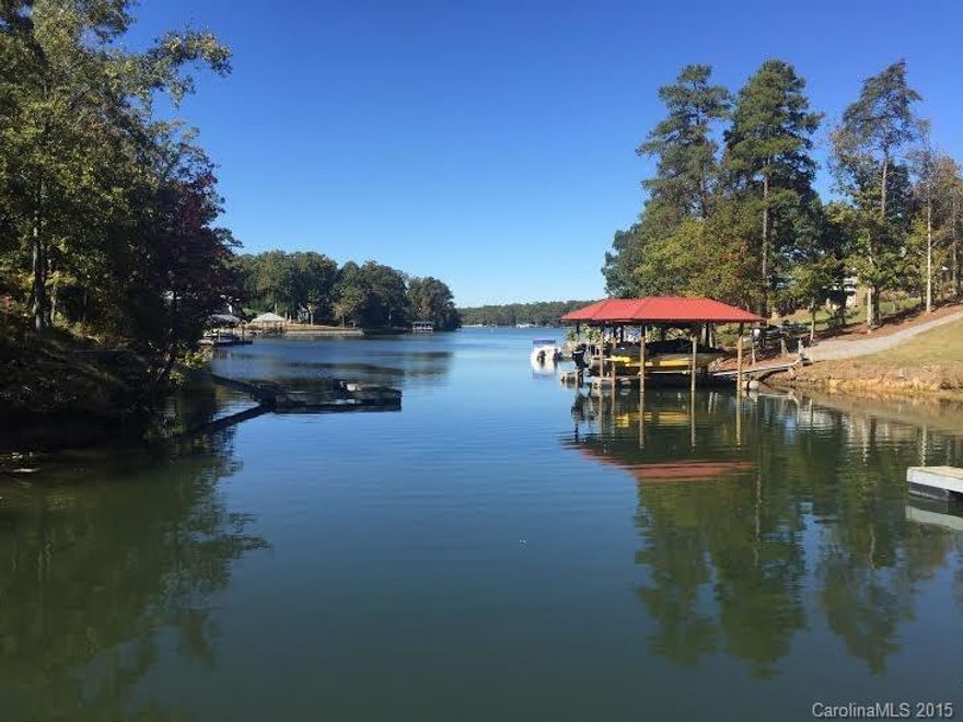 AS SEEN IN LAKE WYLIE TODAY MAGAZINE, LIVING HERE IS LIKE HAVING A HOME & VACATION PLACE ALL IN ONE! GOURMET KITCHEN, 2 STORY GREATROOM-FIREPLACE, AMAZING DECK/SCREENED PORCH W/ FP, CUSTOM THEATRE, SECOND KITCHEN-BAR,WINE CELLAR-CUSTOM WINE RACKS-ENTERTAINMENT AREA, PAVERS SURROUND THE INGROUND PEBBLE TEC lined Concrete pool ,TANNING LEDGE-OUTDOOR covered sitting area w fans, Outdoor shower. fire pit *Boat Dock & Lift.Covered dock w boat lift-10x10 float-400 sqft strge blding w loft