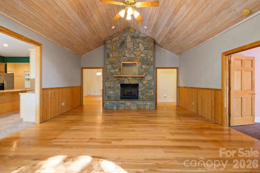 Discover your hidden lake front oasis in the mountains at this stunning 3 bedroom, 3.5 bathroom home nestled on 1.11 private acres. With over 3,100 sq ft of thoughtfully designed living space, this property offers the perfect balance of comfort, privacy, and natural beauty. Step inside to find a spacious open layout with the primary suite on the main level, creating ease of living. Large windows bring the outdoors in, highlighting lake views and filling the home with natural light. Outside, enjoy the best of mountain living. A private trail leads directly to one of two serene community lakes, ideal for kayaking, fishing, or quiet reflection. A circular driveway offers convenience and curb appeal, while the wooded setting provides unmatched privacy. Whether you’re looking for a full-time residence or a peaceful getaway, this home truly feels like a retreat. With multiple living areas, ample storage, and plenty of room to host family and friends, it’s designed for both relaxation and connection. Just minutes from historic downtown Saluda’s shops, dining, and outdoor adventures, yet tucked away in your own tranquil escape.