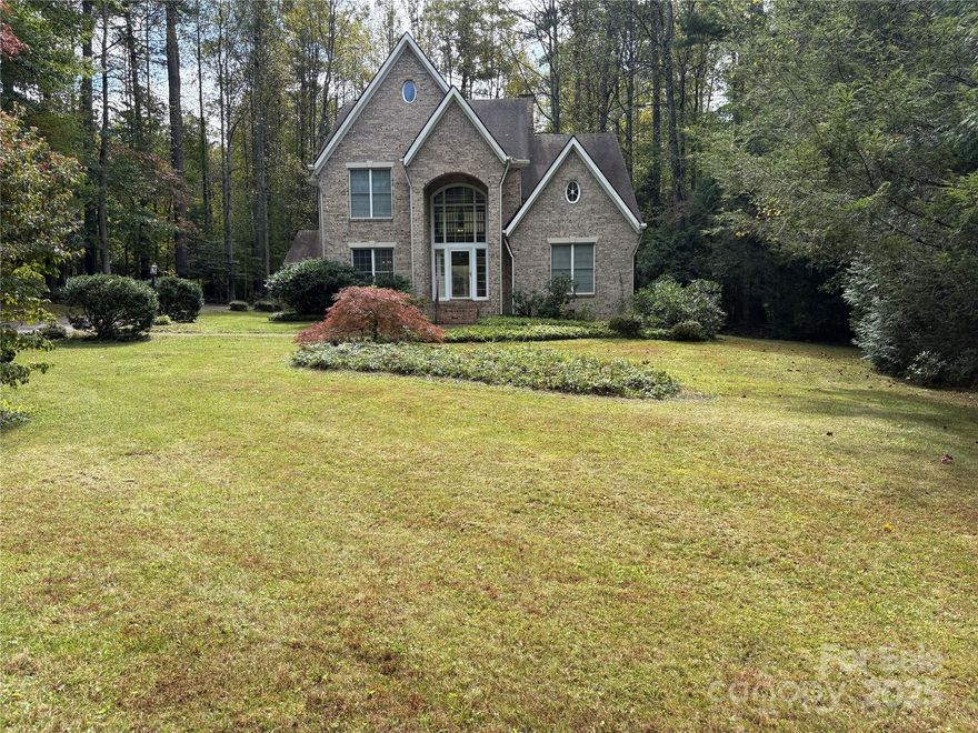 Impressive custom home in historic flat rock w/lake view! 2-st. Foyer, hardwood floors, crown molding, and lots of natural light. Great room has a gas fireplace and is adjacent to a Solarium sunroom overlooks private landscaped level back yard. Large deck adjacent to great room and sunroom for outdoor entertainment and grilling. The Kitchen just off the great room, features quartz counter tops, two pantries, large breakfast area with a window seat and built ins. Primary on main walk-in closet. Primary bath has double sinks, tub and separate shower. Upper-level boast large 2nd family room, 3 bedrooms and 2 full baths. One of the bedroom and bath are together creating a 2nd primary bedroom for your short or long-term guest. Very spacious house! Oversized 2 car garage with workshop area. Features Whole House Generator. The large landscape yard is a gardener’s delight, filled with native Western North Carolina plants overlooking a Lake!. An outstanding home!