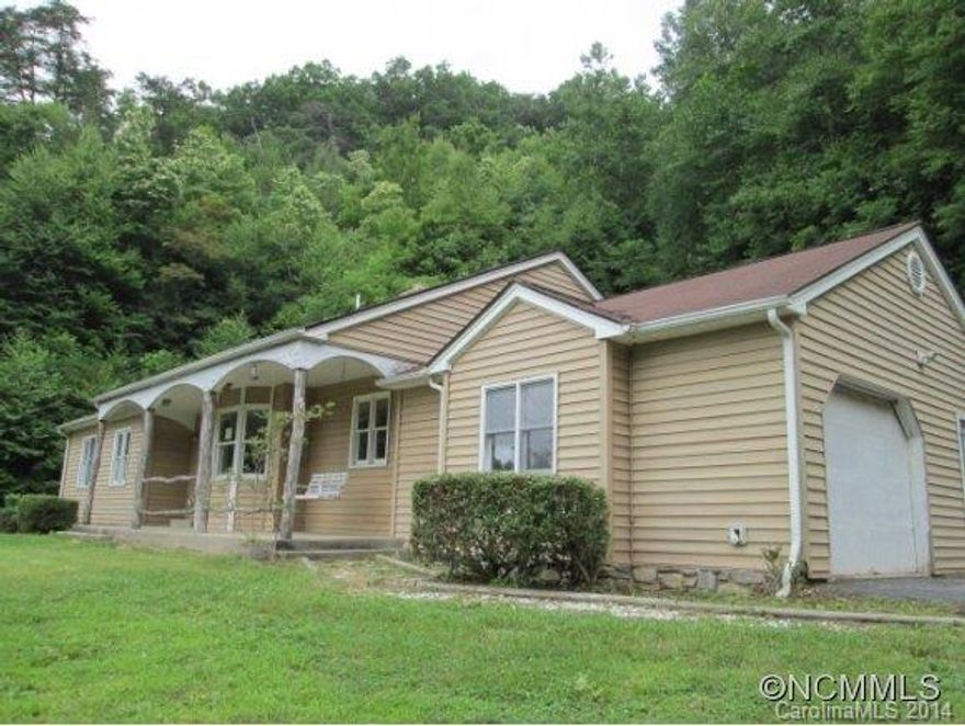 One level living on 7 acres. Unfinished rehab project. Home has covered front porch with mountain views, fireplace, single garage, outbuilding and a barn located prior to the home on the left side of the road. Most of the acreage is rolling to steep but private. Property approved for HomePath Renovation Mortgage.