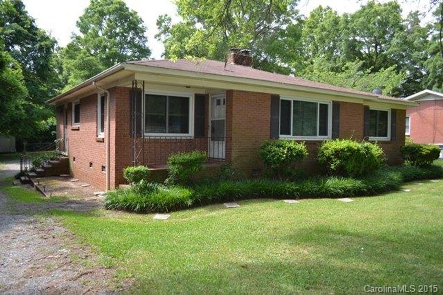 Wonderful brick ranch with tons of hardwood floors.  Large living area with fireplace, dining room, spacious kitchen.  3 bedrooms, 2 full baths and a den area.  There is a fenced dog pen in the back.  Convenient to middle school, right across street from Cherry Park.  Great location!