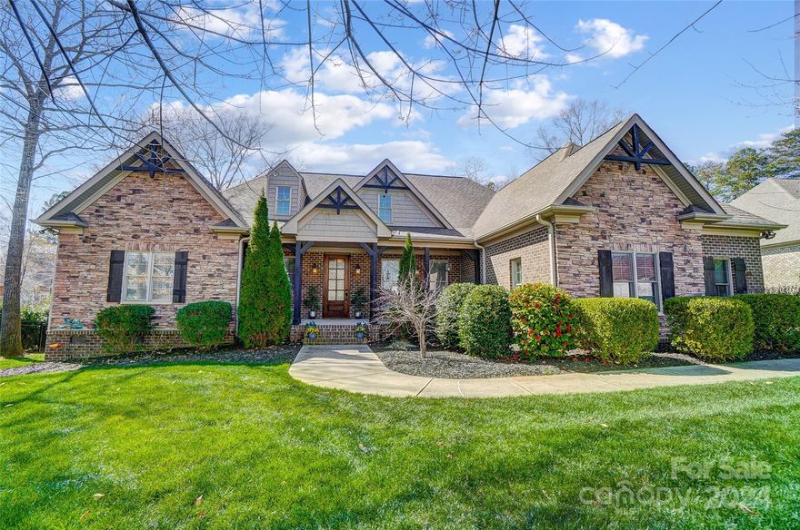 Step into your dreamy luxury lifestyle w this custom craftsman masterpiece located in the sought-after custom neighborhood of Stanton Heights. The welcoming front porch will greet family & friends. Just off the entry foyer a pretty formal dining room sets the stage for elegant entertaining. Adorned w custom coffered ceilings & a stone fireplace, the great room exudes warmth and charm. The beautifully appointed designer kitchen, open to the great room, is perfect for gatherings & making memories.  The gorgeous primary suite is on the mail level, w an exquisite bathroom, large walk-in closet & private access to the covered rear porch. Enjoy outdoor living on almost 1/2 acre w a custom pool, a large covered screened porch for summer parties, & the privacy of green space. Additional highlights include 2 other bedrooms on main,  a 4th bedroom and spacious bonus/bed room upstairs, huge walk-in storage and a 3 car garage. Experience luxury and functionality in every detail. Fort Mill Schools.