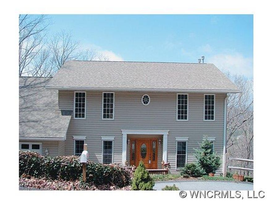 Conveniently located to Downtown Asheville and the Blue Ridge Parkway. Low maintenance, high efficiency with open living area. Hardwood floors, fireplaces, gourmet kitchen with granite countertops, hickory cabinets and high end applicances. Formal dining room and great deck with views for entertaining or relaxing after hard day.-