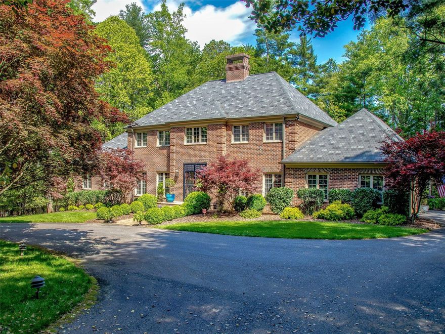 Gracious rooms with high ceilings and wonderful flow invite you to live the luxury lifestyle in Biltmore Forest. The main floor features formal rooms, a great room, a sunroom and an office as well as a spacious master suite. French doors flow onto the deck overlooking a very private wooded rear yard. A circular drive delivers you to this impressive all brick top quality home designed for entertaining and convenient everyday living. Four bedrooms with copious closet space fills the second floor while a daylight rec room, a full bath and great storage spaces populate the basement. Located on a quiet cul de sac within walking distance of Carolina Day School this fine home offers convenience to a membership country club, vibrant downtown Asheville as well as Biltmore Village and Biltmore Park. The Blue Ridge Parkway and Mountain to Sea Trail are within walking distance. With it's own Town police force your peace and security are ensured.