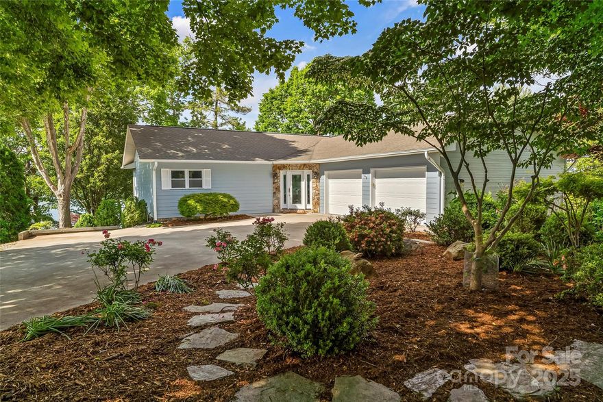 Situated on the very point of Mallard Cove, this home has views straight across the main channel to Lake James SP and the Blue Ridge Mountains.  Huge windows across the entire rear of the house showcase the lake, view & beautiful landscaping. Main level great room, open kitchen with loads of counter space, island, walk in pantry & gas log stone fireplace.  Primary suite with newly updated bath featuring large walk in shower. Lower level finished with laundry, 3 bedrooms & hall bath, family room & additional craft/flex space. Spacious screened porch off kitchen w/steps to the covered dock & swim platform. Amazing landscaping with azaleas, rhododendron, peonies and more. The entire point has been wrapped in the strongest rock basket wall ensuring a stabilized shoreline for life.  Two car garage & flat concrete drive for parking.  Enjoy the amazing views in this small, quiet gated community on Lake James. Close to Lake James State Park, Fonta Flora Trails, I-40 & 20 minutes to Morganton.