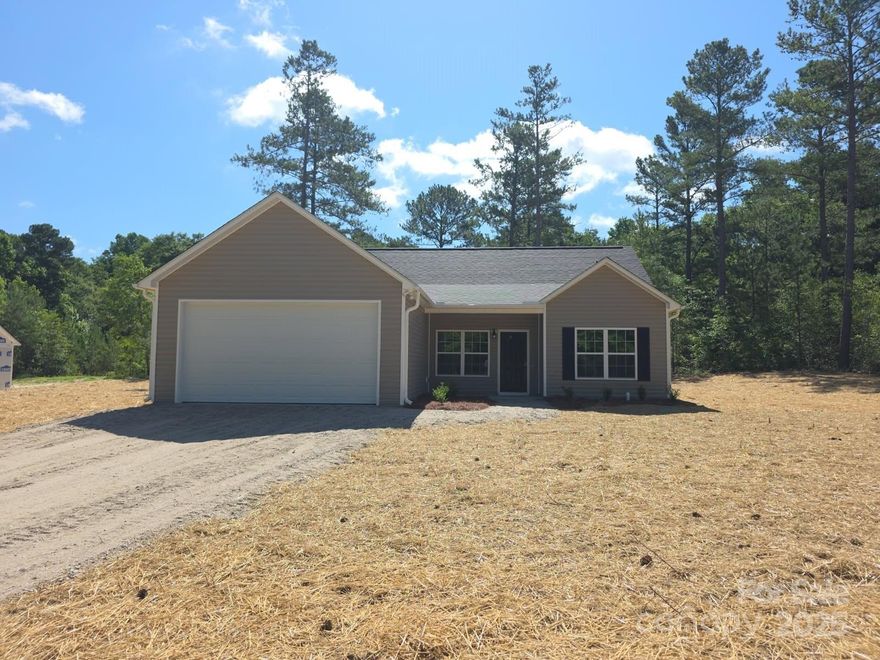 There is no wasted space in this adorable, 3 bedroom, 2 bathroom, proposed to be built floorplan, nestled behind established trees, on a spacious 2.03 acre lot.  The split bedroom plan affords privacy for the primary bedroom/bathroom, that features double vanity and walk in closet.  The other two bedrooms have easy access to the full hall bathroom.  The eat in kitchen, features granite counters, wood cabinets, SS appliances and is open to the great room. Other standard additional features include LVP flooring throughout, ceiling fans, crown molding and recessed lights. There is a front load garage.  If you are looking for proposed new construction, outside the city limits of Pageland, with a large lot, this one may be for you!