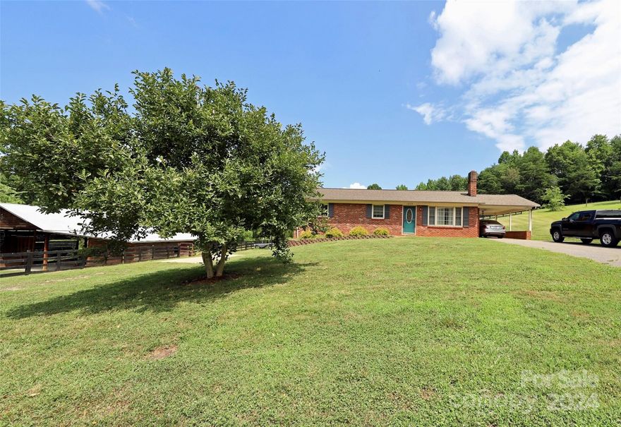 Brick home, partially finished basement, barn and nearly 4 acres of land!
City water, sewage, and garbage pick-up. Location is at the end of the road. The barn has electricity and water, and 4 horse stalls ready for horses or other animals. The pasture and barn are fenced in. The kitchen and bathroom have been updated within the last 4 years. New flooring on the back 2 bedrooms, and updated floor in the 3rd bedroom in the last few years. Beautiful original wood floor in the living room. The roof is less than 10 years old. The heating and air system is approximately the same age. Mitigation for potential radon installed recently. Washer and dryer connections in the basement. This lovely home is close to amenities with easy access to 321!