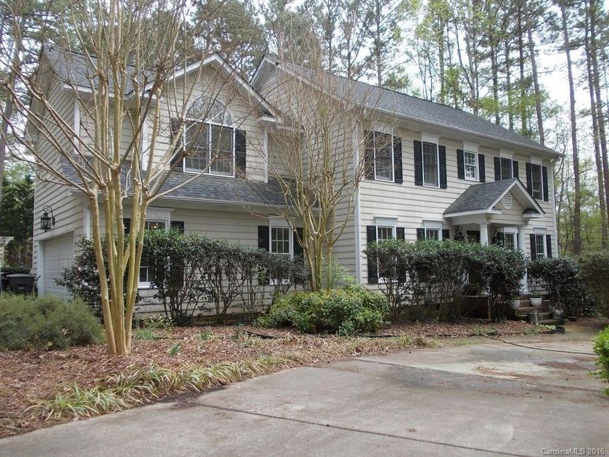 This larger 2 story home features 4 bedrooms, 2.5 bathrooms and over 2800 square feet. It has a formal living room, formal dining room, large family room and great kitchen with breakfast area and service bar. Master has walk in closet and private bath with large tub, his/hers vanities and shower. Screened patio, 2 large deck areas, fenced yard and wooded lot. This home is on over an acre in a quiet community just off Waxhaw Hwy near Hwy 521. Close to Fort Mill and minutes from Charlotte.