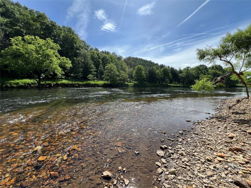 Riverfront recreational lot ready for you to come enjoy this summer. Level lot with easy access in and out of the river. Surrounded by mountain views and looking across the river at state owned land.

Bring your tents or campers and enjoy making memories along the banks of the South Fork of the New River. Come enjoy everything life in the High Country has to offer.

Popular nearby destinations include the New River State Park system, Blue Ridge Parkway, Grayson Highlands, and Virginia Creeper Trail. Centrally located a scenic 25 minute drive from West Jefferson or Sparta.

Drive time to CLT or Triad is less than 2 hours, and Raleigh 3.5 hours. Approximate property lines are marked with pink tape but should be verified by a licensed surveyor.