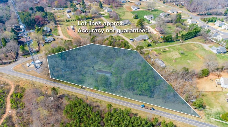 This is a 2.7 Acre Tract of land with appox 520 ft of road frontage that could easily be divided into 4 building lots. The 2 story home & mobile home are of no value and will need to be removed by the buyer. All zoning will need to be approved by the Town of Troutman. Excellent Location close to Shopping, Restaurants, Schools & Statesville Airport with easy access to I-77 & I-40.