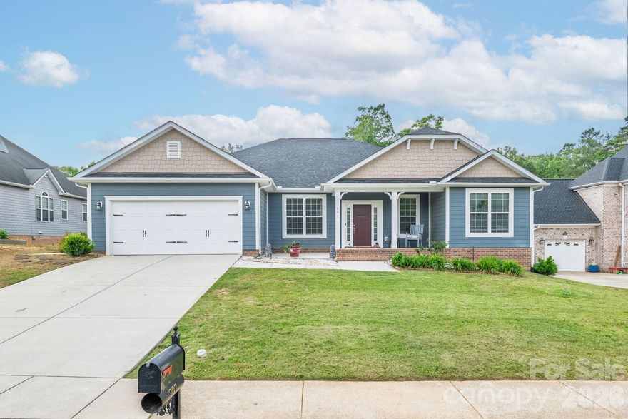 Welcome to A CITY WITH A SOUL.  Discover the perfect blend of small town charm and modern luxury in this stunning 4 bedroom, 2 1/2 bath ranch located in the heart of Locust, NC. Spanning 2,285 square feet, this home sits on a generous half an acre lot, offering a rare combination of privacy and room to breathe within a vibrant community. This home welcomes you to experience the airy feel of soaring ceilings that perfectly complement the open concept floor plan. Kitchen features granite countertops with a large island and an oversized walk-in pantry, perfect for bulk shopping and keeping your kitchen flawlessly organized. The primary suite is a true sanctuary featuring a generous walk-in closet and a spa-like ensuite bath complete with a soaking tub, separate shower, and private water closet.
There are three additional well-appointed bedrooms that can provide flexibility for a home office, hobby room, or guest space. Enjoy your morning coffee on the inviting large front porch or unwind in the evenings on the screened-in back porch, free from the elements.
A 2-car garage provides ample parking and a storage space, while the 10x12 shed in the backyard offers extra storage for tools or outdoor gear. Locust isn't just a place to live; it's a lifestyle. This golf cart-friendly community keeps you connected to everything. Locust Town Center: Just minutes away, enjoy community events like outdoor movie nights, seasonal festivals, and local gatherings. Unbeatable Convenience: Walmart, local boutiques, and a variety of dining options, from local favorites to national chains that are all less than 5 minutes away.
Recreation: Spend your weekends at the neighborhood swimming pool which is within walking distance or tee off at the nearby Red Bridge Golf Club. Experience the soul of Locust in a home designed for comfort and connection. Located only 13 minutes from I-485. Schedule your showing today!