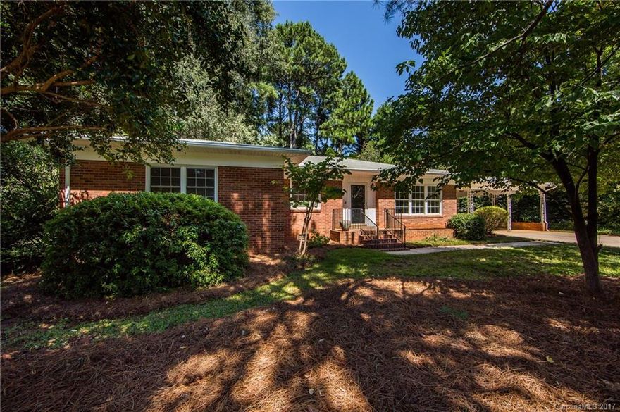 This is a gorgeous brick ranch home nestled on a 0.63-acre lot in the heart of Statesville. This is a four-bedroom, two-bath home with newly refinished hardwood floors, new carpet, fresh paint and new plumbing fixtures! There is a large oversized side covered patio with two-car covered carport with storage rooms and a private deck off the dining area. Take advantage of a large outbuilding to store more yard tools. Enjoy lots of privacy on this gorgeous lot!