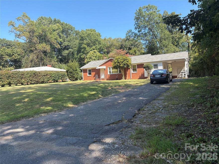 Welcome to this beautiful and  well-maintained property 3-bedroom, 1.5-bath full-brick home offers timeless charm with original hardwood floors throughout. The open-concept layout creates a bright and inviting space, perfect for modern living. Nestled in a quiet neighborhood and just minutes from downtown Charlotte, you'll enjoy the convenience of city amenities while still having a cozy retreat to call home. Solid brick construction ensures durability, classic appeal and respectful.