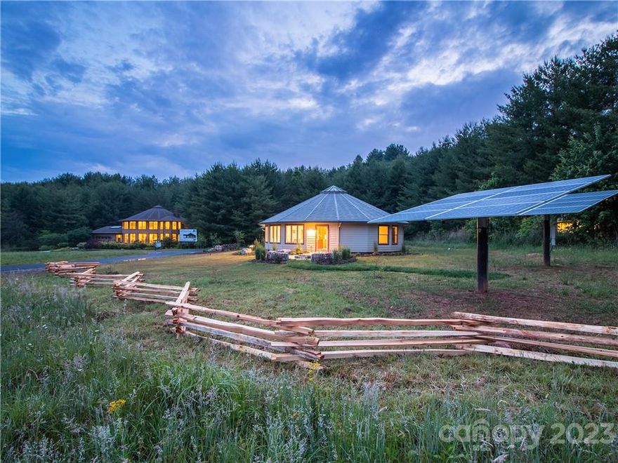 This unique property has a wide variety of potential uses as it includes two high end structures built by Deltec and a total of 5.11ac with plenty of room for additional development.  The majority of this parcel is flat and sits adjacent to I-26 so advertising visibility is substantial.  The two structures on the property are utilized as the Deltec Homes sales center and are an incredible example of the company's dedication to the highest quality modern design and green building practices. Building one is 4,720sf and building two is 1,500sf and a net zero energy structure.  With the combination of buildable land and the existing structures, this property could be utilized as an office/corporate headquarters, private or commercial retreat center,  rental community, private estate, or any number of development options. Only 5 minute's drive to the town of Mars Hill and Mars Hill University, and 20 minutes to Downtown Asheville.