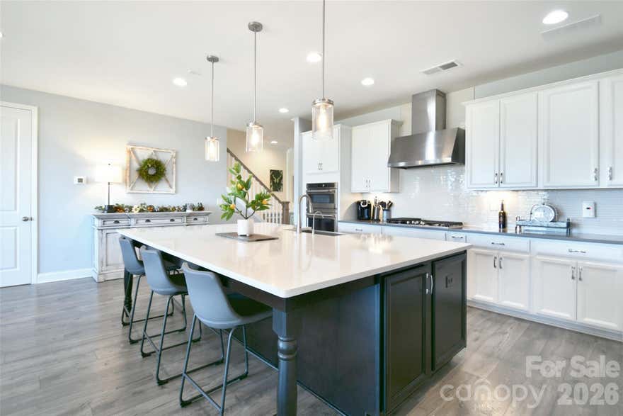 HUGE PRICE IMPROVEMENT- now the lowest price per sf with a basement in the Hough district! You won't find these upgrades and floorpan in new construction!

Preferred lender offering huge limited-time lender credit plus free appraisal with seller-accepted offer.

Beautifully situated on a premier private lot in the highly desirable Walden community, your new home is thoughtfully designed with 5 bedrooms, 5.5 bathrooms.  Providing exceptional comfort for modern living, this home also includes a versatile office/den/bedroom on the 2nd floor complete with its own full bath.

Step inside to an open-concept main level ideal for entertaining, featuring a gourmet kitchen with GE Café Series appliances, quartz countertops, elegant glass cabinetry, a large center island, and abundant storage. The primary suite is a serene retreat on the main level with 4” plantation shutters, a spacious custom walk-in closet, and a spa-inspired ensuite bath.

Every bedroom boasts its own private bathroom. Additional enhancements include epoxy floors in the garage, a 4-ft extended garage length, widened driveway, and a large unfinished storage room in the basement with the potential to be finished to suit your needs. Pre-wiring for audio and security adds modern convenience.

The backyard is a true oasis—super private and perfect for entertaining. Enjoy Techo-Bloc Blu pavers, a stylish retaining wall, a fully equipped gazebo with bar, intimate gas fire pit, and an outdoor kitchen featuring a commercial-grade grill and dual burners. With ample space to add a pool, the possibilities for creating your dream retreat are endless. Attractive custom woven wood/grass Roman shades in the family room add warmth and character.

Located within minutes of Birkdale Village, Lake Norman, parks, greenways, NorthStone Country Club, the U.S. National Whitewater Center, golf, dining, and quick access to I-77 and top-rated schools—this home delivers the ultimate Huntersville lifestyle in a top school district. 

Outdoor charm meets modern luxury in this one-of-a-kind property. Don’t miss this exceptional opportunity!

* rendering of pool are digitized and are shown to depict a possible future pool