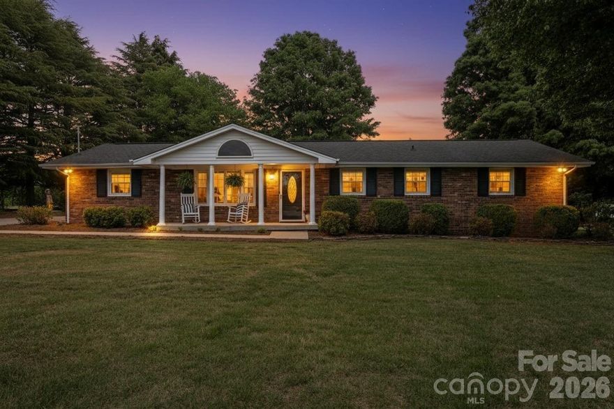 You can always update a house, but you can’t recreate character—and this charming all-brick home is full of it. Welcome to 3328 Sulphur Springs Rd, situated on a corner lot in desirable NE Hickory with no city taxes. This well-maintained one-level home offers two separate entrances, a covered rocking chair front porch, fresh paint throughout, and real natural hardwood floors. The open living area flows into a spacious kitchen featuring granite countertops, custom cabinetry, stainless steel appliances, and a stylish backsplash. A second den provides additional living space with a beautiful stone fireplace, while the covered enclosed sunroom is the perfect place to relax or entertain. The home offers spacious bedrooms, including a primary bedroom with a convenient half bath, along with a large full bathroom featuring granite countertops and a tub/shower combo. Conveniently located just minutes from parks, Lake Hickory, and in the desirable St. Stephens school district, this inviting home offers the perfect blend of character, comfort, and location.