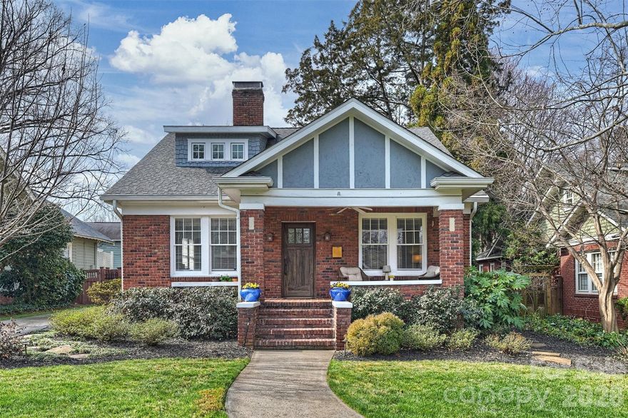 Opportunity to live on a premier street in Historic Dilworth. This charming 1.5 story, four bedroom, 1924 bungalow home on Dilworth Road East welcomes you with a sidewalk lined street and a covered front porch perfect for greeting neighbors. Step inside to 9 foot ceilings that create an immediate sense of openness. The living room, anchored by a cozy gas fireplace, is ideal for entertaining guests. A separate den with built-in shelves offers a comfortable space to relax. Down the hall, the primary suite on the main level features a spacious, remodeled bathroom and a walk-in closet. A second bedroom and full bath are also located on the main floor. The large kitchen with newer windows continues with the hardwood floors found throughout and opens to a cozy breakfast room overlooking the backyard. The laundry room is conveniently located just off the kitchen and includes a washer and dryer. The dining room, complete with a charming built-in cabinet, is perfectly positioned between the kitchen and living room. Newer blinds in the kitchen, dining room, and living room. Upstairs, a large flex space provides the perfect setting for a home office, gym, or playroom. Two additional bedrooms with storage share a full bath. Outside, the fully fenced, professionally landscaped backyard features a covered outdoor living space with a wood burning fireplace, creating a wonderful setting to relax while watching your favorite show on the conveyed TV. Low maintenance turf in the backyard enhances the outdoor space. The backyard landscaping and front yard has an irrigation system. The garage offers additional storage for bikes and more.