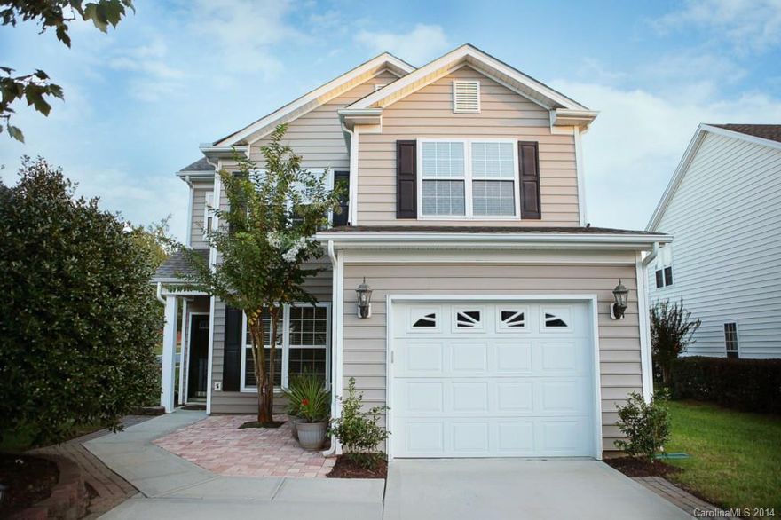 Beautiful former model home set on premium lot in interactive swim community mere moments to Charlotte! Formal Dining Room. Vaulted Great Room with fireplace & TV niche. Kitchen and Breakfast nook lead to amazing brick patio with custom grill and fireplace. Master with vaulted ceiling & wonderful walk in closet. Extensive exterior and landscape lighting and water fountain option. Playground & pool!