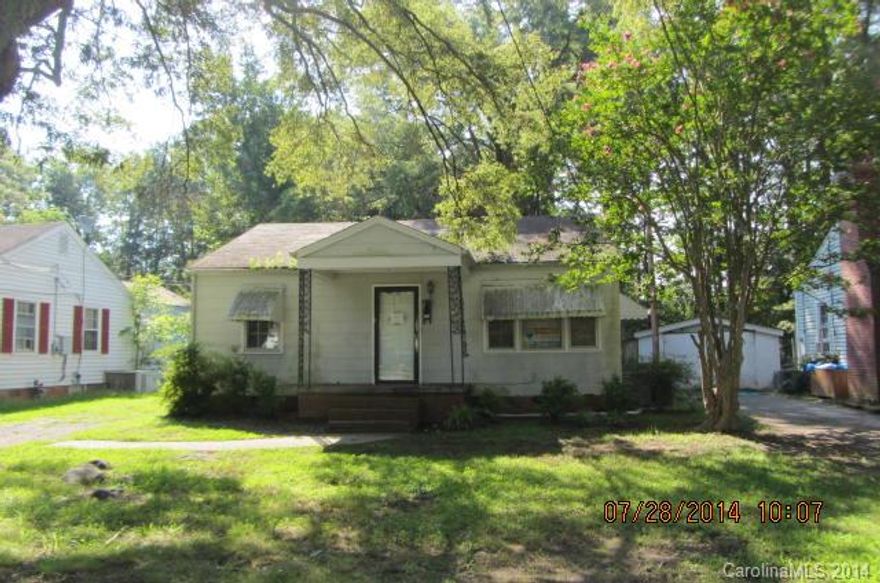 Hardwood floors, large kitchen. Large lot, front porch, detached carport.