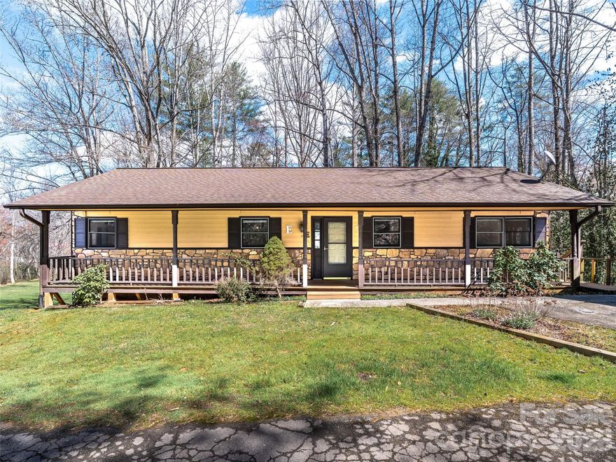 Welcome to your peaceful Etowah retreat! This rare condo is a true hidden gem. Unlike most units, it shares no common walls with neighbors, giving you the ultimate privacy of a detached home. Offering nearly double the space of recent neighborhood sales, it is priced to sell and leaves room in your budget for future cosmetic updates. Step inside an inviting living room with vaulted ceilings, exposed beams, skylights, and a stunning stone fireplace. The main level features new carpet and flows out to a screened-in porch and open deck with tranquil pond views. Downstairs, a massive, partially finished walk-out basement with a private entrance offers endless potential for a recreation or hobby room. Nature lovers will adore the close proximity to DuPont State Forest and the Ecusta Trail! This premier greenway is expanding through Etowah, offering miles of scenic paths moments from your door.