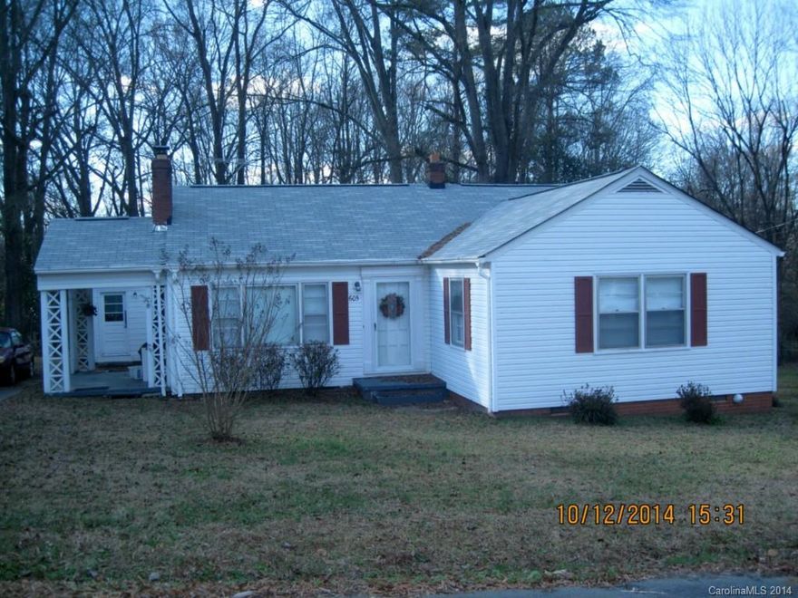 THIS IS YOUR CHANCE - REAL hardwoods in all areas except kitchen and baths.  Freshly painted. Large family room with fireplace and gas logs.  Dining room adjoins Kitchen and Family.   3 Bedroom-2 bath home. Baths have ceramic surrounds.  COVERED SIDE PORCH.  PERFECT FOR INVESTOR OR FIXER-UPPER.