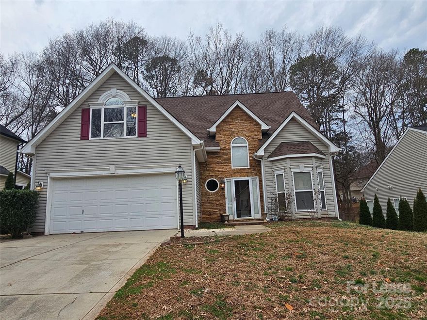 Don't miss out on this fantastic 3 bed, 2.5 bath, 1,927 sq. ft. home in the Barkley community, offering a pool, playground and tennis! Hardwood floors welcome you into this home featuring a bay-windowed front room that could be used as a dining room, living room or office. A great room with vaulted ceilings and a cozy fireplace opens to the fully equipped kitchen. Sip your morning cup of coffee at the breakfast bar or on the backyard patio!  
Your coveted first-floor primary suite boasts a dual sink vanity, walk-in closet, soaking tub and separate shower. Upstairs, two additional bedrooms share a second full bath. Take advantage of all the storage of the attached 2 car garage and the workshop in the fenced back yard with a covered porch! Your new home is located near I-77, I-485, Auten Nature Preserve, Richard Berry Memorial Park, restaurants and shopping!