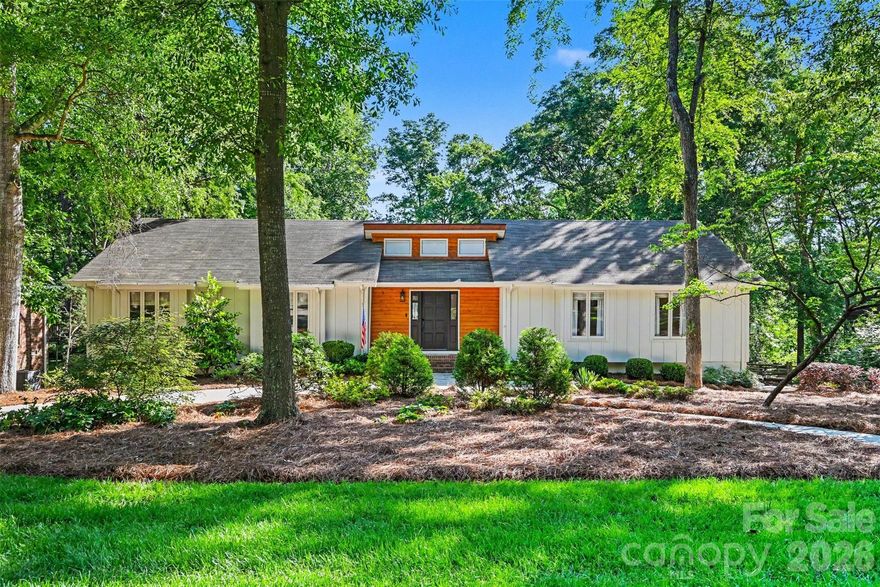 Rarely does a home of this caliber come to market at this price in Montibello. Set on a .54-acre private lot on one of the neighborhood's most coveted streets, this fully renovated contemporary delivers designer-level finishes, exceptional outdoor living, and a flexible floor plan that works for how people actually live today. The chef's kitchen is the heart of the home — quartzite countertops, large center island, professional gas range, wine fridge, and custom cabinetry, all open to the main living areas. Hardwood floors and abundant natural light flow throughout. The primary suite anchors the main level with its own beautifully renovated bath, joined by two additional bedrooms that share a stunning double-vanity bath of their own. A separate living room/office with custom built-ins adds the work-from-home flexibility today's buyers demand. The lower level expands the living space dramatically — a large bonus room with fireplace and wet bar, a full guest suite, and a covered patio that opens directly to the backyard. Above, a sprawling deck overlooks a fenced, tree-lined yard with room to breathe, play, and entertain. A circular driveway, lush landscaping, and a location minutes from Carmel Country Club, top dining, grocery, and shopping complete the picture. Of the last 15 homes sold in Montibello, 11 closed above this price. The value here is real.